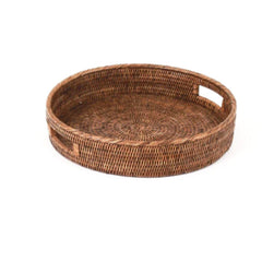 Photo of dark rattan round tray with open handles in two sides.