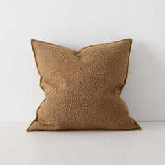 Photo of copper coloured boucle cushion