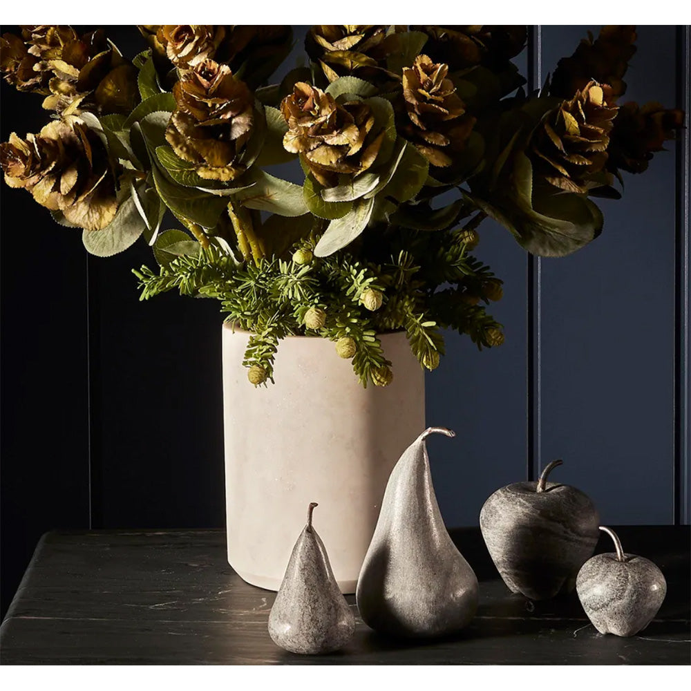 Photo of black marble pears and apples in different sizes  with metal stalks