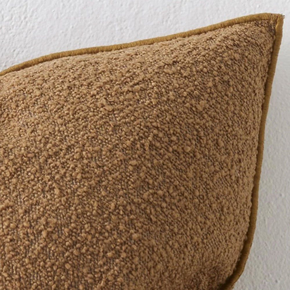 Photo of copper coloured boucle cushion